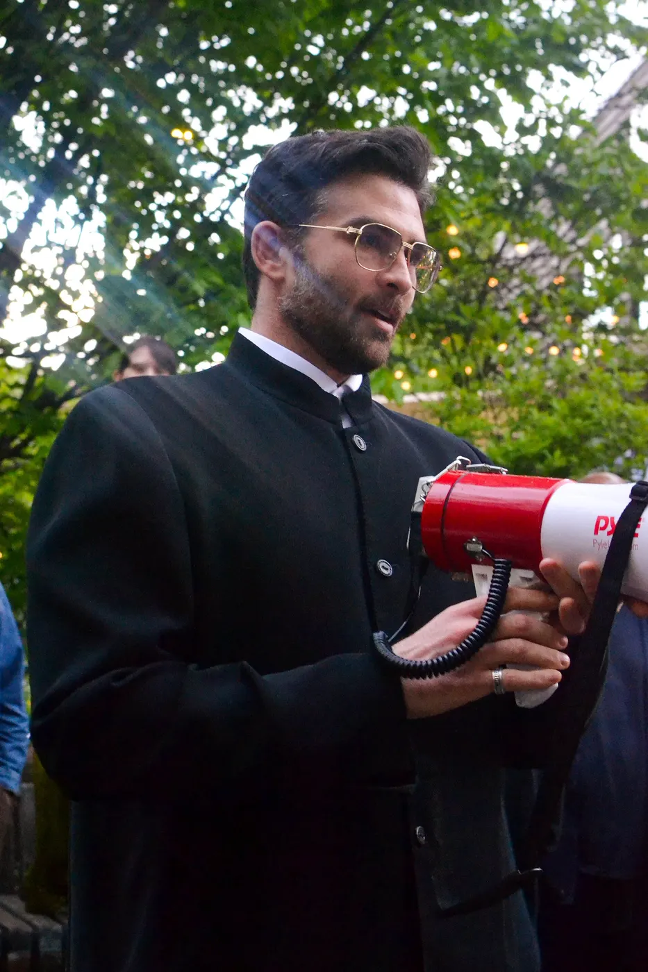 Hasan Piker at a podium during a Chris Rabb campaign rally in Philadelphia