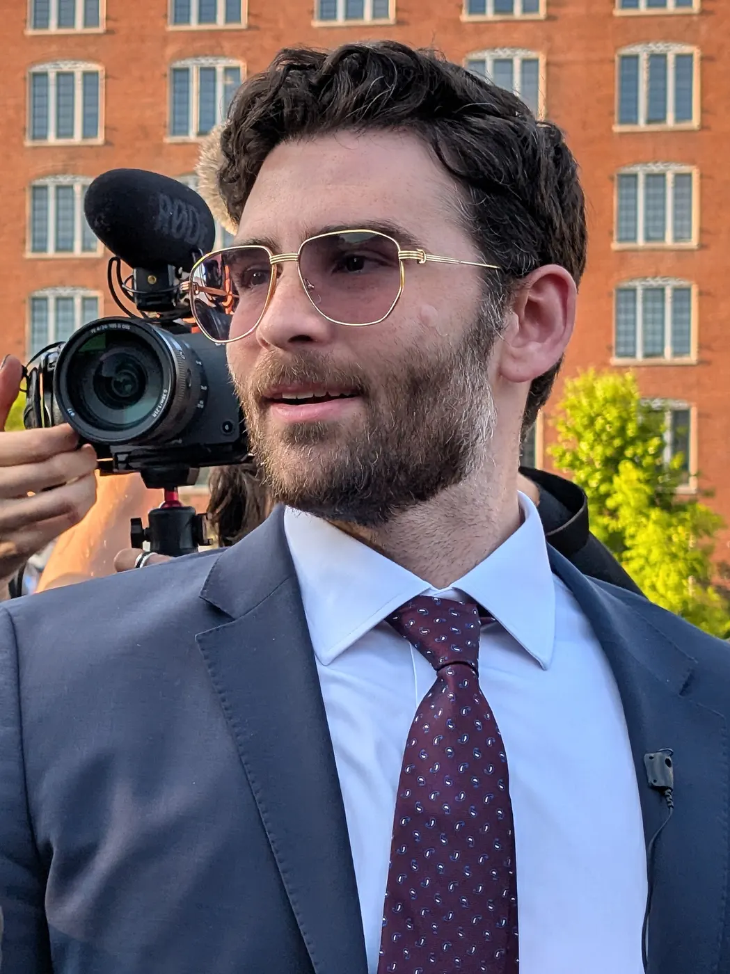 Hasan Piker taking photos with attendees after the Cori Bush rally in St. Louis